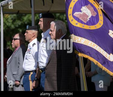 (R to L) Gus Rodriguez, Jr., civilian aide to the Secretary of the Army for Southwest Texas; Command Sgt. Maj. Michael Williams, the 1st Armored Division and Fort Bliss command sergeant major; and Col. James Brady, the Fort Bliss garrison commander; at the Fort Bliss National Cemetery Memorial Day ceremony in northeast El Paso, Texas, May 30, 2022. Civilian aides to the Secretary of the Army are business and community leaders appointed by the secretary to advise and support Army leaders across the country. Stock Photo