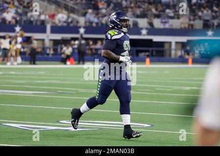 Seattle Seahawks defensive tackle Myles Adams (95) walks off the field  after an NFL football game against the Carolina Panthers, Sunday, Dec. 11,  2022, in Seattle, WA. The Panthers defeated the Seahawks