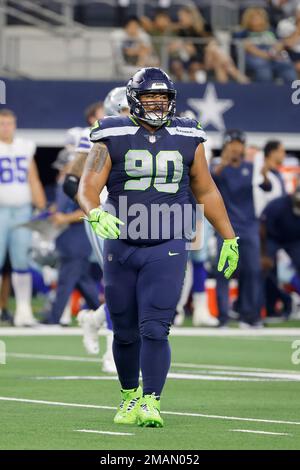 Seattle Seahawks defensive tackle Bryan Mone (90) prepares for the