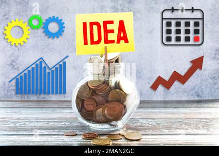 Light bulb with a diagram on wood block with word IDEAS, new idea concept with innovation and inspiration, innovative. Great idea concept Stock Photo