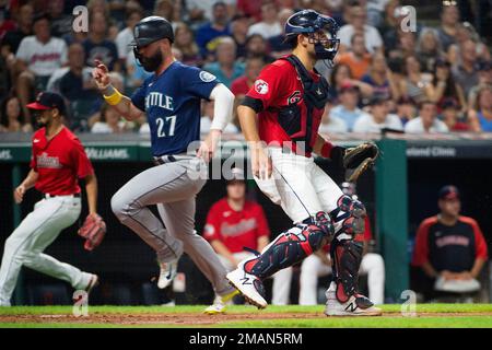 Seattle Mariners 'Jesse Winker (27) celebrates with Dylan Moore (25) after  hitting a solo home run against the Oakland Athletics during the seventh  inning of a baseball game in Oakland, Calif., Tuesday