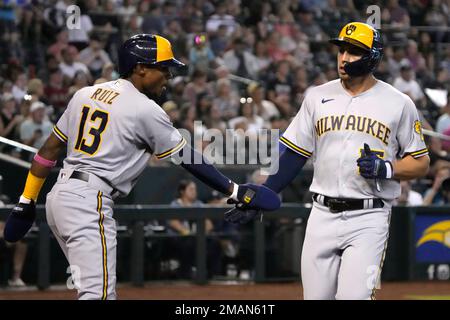 Milwaukee Brewers' Tyrone Taylor celebrates with Keston Hiura