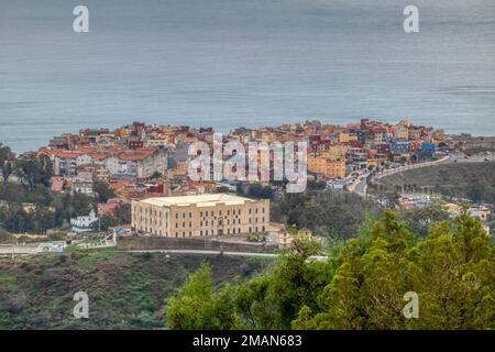 In the foreground we see the Legion headquarters and in the background the neighborhood of El Principe, located in the city of Ceuta, Spain Stock Photo