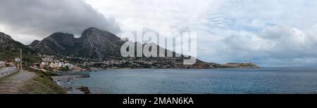 View of the mountain called Jebel Musa, also known as La Mujer Muerta (The Dead Woman), at its feet the Moroccan village of Belyounech and in front th Stock Photo