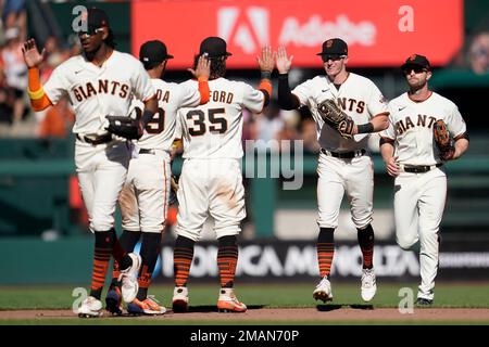 San Francisco Giants' Lewis Brinson, from left, celebrates with