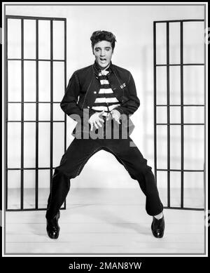 JAILHOUSE ROCK Elvis Presley film still from the iconic seminal Movie & Song 'Jailhouse Rock' 1957 The song lyrics start... 'Warden threw a party in the county Jail'. Elvis Presley action publicity studio still promoting the film 'Jailhouse Rock' Hollywood USA Stock Photo