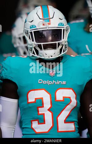 Miami Dolphins safety Verone McKinley III adjusts his helmet as he waits to  go out on the field before the start of an NFL preseason football game  against the Las Vegas Raiders