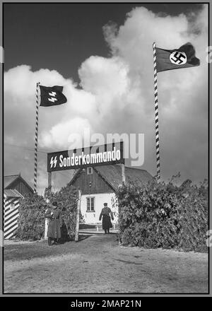 SOBIBOR EXTERMINATION CAMP ENTRANCE SONDERKOMMANDO  1942-43  Entrance gate at the Nazi death camp Sobibor in Nazi German-occupied Poland. Nazi Waffen SS and Swastika flags flying overhead. Sonderkommandos were work units made up of German Nazi death camp prisoners. They were composed of prisoners, usually Jews, who were forced, on threat of their own deaths, to aid with the disposal of gas chamber victims during the Holocaust. The death-camp Sonderkommandos, who were always inmates, were unrelated to the SS-Sonderkommandos, which were ad hoc units formed from members of various SS offices Stock Photo