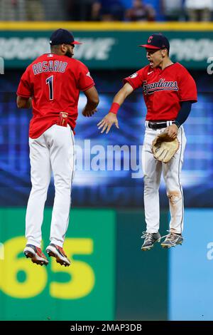 Cleveland Guardians' Amed Rosario (1) and Steven Kwan, right, celebrate  after defeating the Tampa Bay Rays in a wild card baseball playoff game,  Friday, Oct. 7, 2022, in Cleveland. (AP Photo/David Dermer