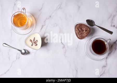 some teas and spoons on a white marble countertopped image is in the top right handout Stock Photo