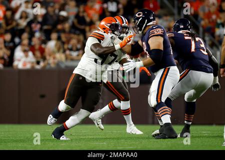 Chicago Bears offensive tackle Riley Reiff (78) and offensive tackle  Lachavious Simmons (73) attempt to block Cleveland Browns defensive tackle  Perrion Winfrey (97) during an NFL preseason football game, Saturday Aug.  27