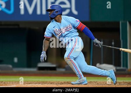 Texas Rangers right fielder Adolis Garcia walks off the field in between  innings against the Seattle Mariners in a baseball game Monday, May 8,  2023, in Seattle. (AP Photo/Lindsey Wasson Stock Photo 