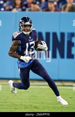 Tennessee Titans wide receiver Racey McMath (13) goes for a catch as he's  defended by Tampa Bay Buccaneers cornerback Dee Delaney (30) during their  game Saturday, Aug. 20, 2022, in Nashville, Tenn. (