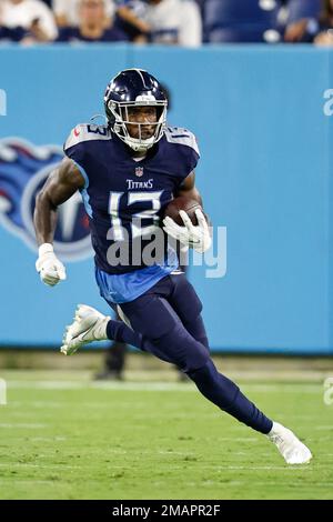 Tennessee Titans wide receiver Racey McMath (13) goes for a catch as he's  defended by Tampa Bay Buccaneers cornerback Dee Delaney (30) during their  game Saturday, Aug. 20, 2022, in Nashville, Tenn. (