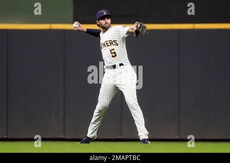 Milwaukee Brewers' Garrett Mitchell warms up on deck before a spring  training baseball game against the Kansas City Royals Monday, Feb. 27, 2023,  in Surprise, Ariz. (AP Photo/Charlie Riedel Stock Photo - Alamy