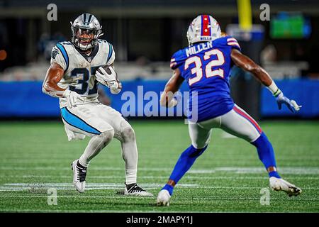 Carolina Panthers running back John Lovett (37) looks for running room  against Buffalo Bills cornerback Jordan Miller (32) during an NFL preseason  football game on Friday, Aug. 26, 2022, in Charlotte, N.C. (