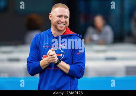 Buffalo Bills quarterback Josh Allen runs a drill with quarterbacks coach  Joe Brady during practice at the NFL football team's training camp in  Pittsford, N.Y., Friday, July 28, 2023. (AP Photo/Adrian Kraus