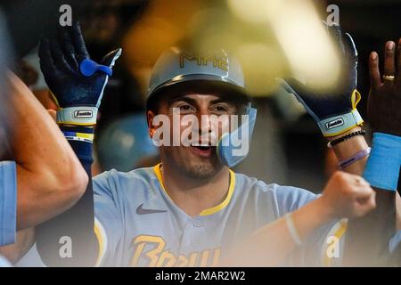 Milwaukee Brewers' Tyrone Taylor is congratulated by Hunter