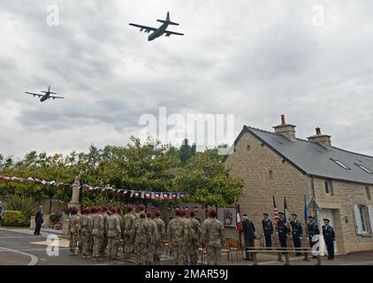 Two C-130J Super Hercules aircraft out of Ramstein Air Base, Germany, fly over Negreville, France during a D-Day ceremony June 3, 2022. On June 6, 1944 a Douglas C-47 Skytrain aircraft crashed near Negreville after being hit by anti-aircraft fire and all aircrew members and paratroopers were forced to jump 12 miles away from their intended drop zone. Stock Photo