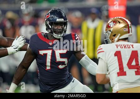 Houston Texans defensive end Adedayo Odeleye (75) walks toward the huddle  during the second half of an NFL preseason football game against the New  Orleans Saints Saturday, Aug. 13, 2022, in Houston. (