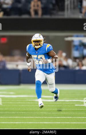 Los Angeles Rams quarterback Bryce Perkins, right, is tackled by Los  Angeles Chargers linebacker Jamal Davis II, bottom, and linebacker Damon  Lloyd (53) during the second half of a preseason NFL football