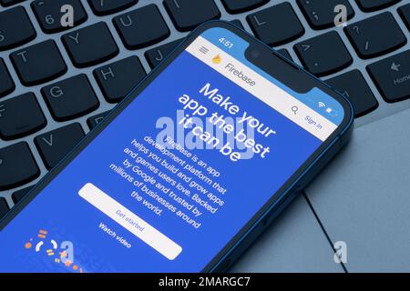 Webpage of Google Firebase is seen on an iPhone. Firebase is an app development platform that helps users build and grow apps and games. Stock Photo