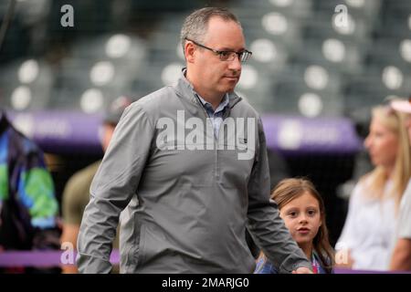 Vinny Castilla, left, special assistant to the general manager of the  Colorado Rockies, greets Chicago Cubs right fielder Carlos Gonzalez before  a baseball game Monday, June 10, 2019, in Denver. Gonzalez was