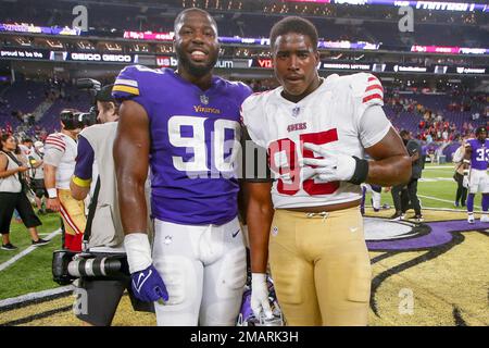 Minnesota Vikings' Esezi Otomewo (90) and Khyiris Tonga celebrate an  interception during an NFL football game against the Chicago Bears Sunday,  Jan. 8, 2023, in Chicago. (AP Photo/Charles Rex Arbogast Stock Photo - Alamy