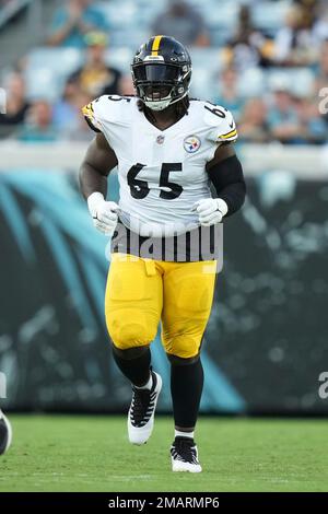 Pittsburgh Steelers offensive tackle Dan Moore Jr. (65) jogs to the line of  scrimmage during an NFL football game against the Jacksonville Jaguars,  Saturday, Aug. 20, 2022 in Jacksonville, Fla. The Steelers