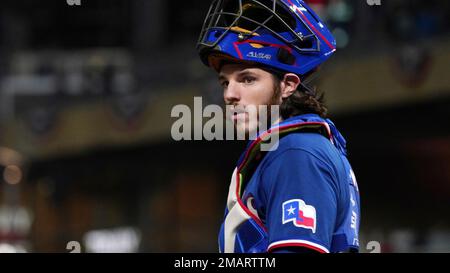 Texas Rangers' Jonah Heim bats during the first inning of a spring training  baseball game against the Colorado Rockies Tuesday, Feb. 28, 2023, in  Surprise, Ariz. (AP Photo/Charlie Riedel Stock Photo - Alamy