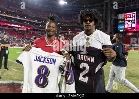 Quarterback (8) Lamar Jackson of the Baltimore Ravens does a jersey swap  and poses with Marquise 'Hollywood' Brown after the Ravens 24-17 victory  over the Arizona Cardinals in an NFL preseason football