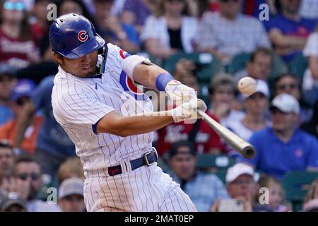 Chicago Cubs' Seiya Suzuki, of Japan, adjusts his hat as he pauses in the  dugout prior to a baseball game against the Arizona Diamondbacks Sunday,  May 15, 2022, in Phoenix. (AP Photo/Ross