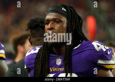 Denver Broncos running back Mike Boone (26) runs against Minnesota Vikings  cornerback Kris Boyd (29) and Minnesota Vikings linebacker Luiji Vilain  (43) during an NFL preseason football game, Saturday, Aug. 27, 2022