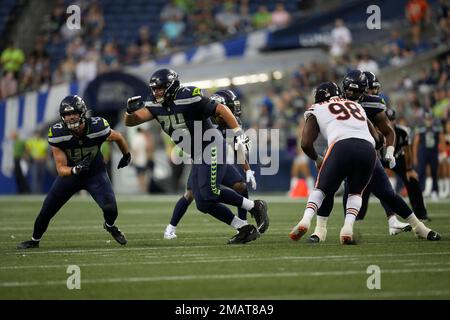 Seattle Seahawks offensive tackle Jake Curhan (74) goes for a block during  an NFL pre-season football game against the Minnesota Vikings, Thursday,  Aug. 10, 2023 in Seattle. (AP Photo/Ben VanHouten Stock Photo 