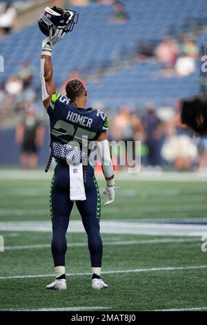 Seattle Seahawks running back Travis Homer (25) during an NFL Preseason  football game against the Chicago Bears, Thursday, Aug. 18, 2022, in Seattle,  WA. The Bears defeated the Seahawks 27-11. (AP Photo/Ben