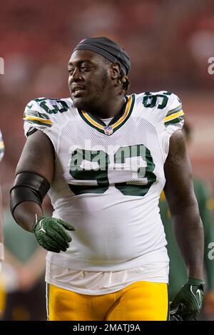 Green Bay Packers' T.J. Slaton runs a drill at the NFL football