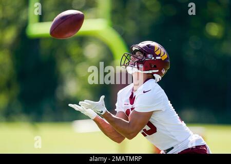 Washington Commanders wide receiver Dax Milne (15) catches the ball during  a NFL football practice at the team's training facility, Wednesday, July  26, 2023 in Ashburn, Va. (AP Photo/Alex Brandon Stock Photo - Alamy