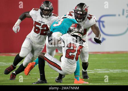 Miami Dolphins wide receiver Lynn Bowden Jr. (3) is tackled after catching  a pass by Tampa Bay Buccaneers cornerback Rashard Robinson (28), linebacker  K.J. Britt (52) and linebacker Elijah Ponder (44) during