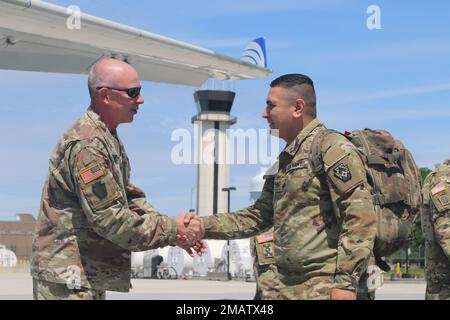 Maj. Gen. Mark Schindler, Pennsylvania's Adjutant General, greets one of approximately 200 Soldiers with the 252nd Quartermaster Company, 728th Combat Sustainment Support Battalion, 213th Regional Support Group, Pennsylvania Army National Guard, departed the Commonwealth June 5 to deploy to the Middle East. The 252nd Quartermaster Company’s mission includes providing both perishable and semi-perishable general supply, retrograde support, petroleum supply, water supply support and shower and laundry services to supported units. It is based at the Southampton Roads Armory in Philadelphia. Stock Photo