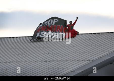 Edinburgh, UK. 19th Jan, 2023. Protesters hold a banner saying 'Stop Arming Israel' during the demonstration. Palestine Activists cut the security fence in the dead of the night and get on the roof of arms factory Leonardo in Edinburgh. They are protesting and highlighting the fact that Leonardo are providing laser guidance systems for Israeli F35 combat aircraft and Hermes 450 drones. These munitions are used against the Palestinian people in Gaza and elsewhere. Credit: SOPA Images Limited/Alamy Live News Stock Photo