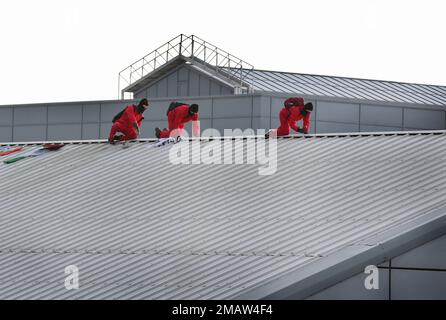 Edinburgh, UK. 19th Jan, 2023. Three protesters crawl along the ridge of the roof during the demonstration. Palestine Activists cut the security fence in the dead of the night and get on the roof of arms factory Leonardo in Edinburgh. They are protesting and highlighting the fact that Leonardo are providing laser guidance systems for Israeli F35 combat aircraft and Hermes 450 drones. These munitions are used against the Palestinian people in Gaza and elsewhere. Credit: SOPA Images Limited/Alamy Live News Stock Photo