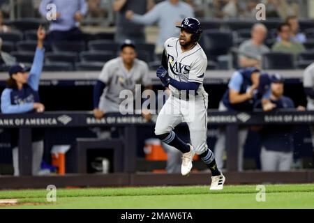 Tampa Bay Rays' Roman Quinn, right, stands on third base after hitting a  two-run triple in the seventh inning against the Kansas City Royals during  a baseball game Saturday, July 23, 2022