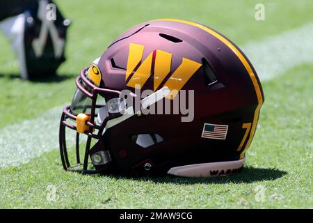 A Washington Commanders' football helmet on the sideline at Fedex Field in  North Englewood, Md., Sept. 25, 2022. As a continuation of the celebration  of the United States Air Force's 75th anniversary