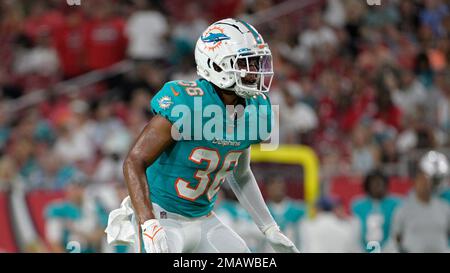 Miami Dolphins cornerback Quincy Wilson, left, tackles Las Vegas