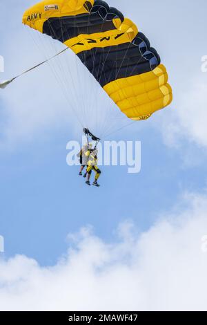 Sgt. 1st Class Ryan Reis of the U.S. Army Parachute Team makes a tandem skydive over Fort Stewart, Georgia on 6 June 2022.  USAPT is conducting skydives in a community outreach event from June 6-7. Stock Photo