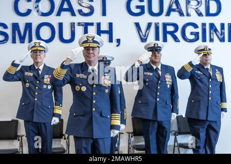 Adm. Steven Poulin, 33rd Vice Commandant of the U.S. Coast Guard, salutes during the arrival of the official party at the U.S. Coast Guard Atlantic Area Command Master Chief Change of Watch ceremony in Portsmouth, Virginia, on June 6, 2022, with the Atlantic Area command behind him. The tradition is rich in military history to allow subordinates to witness the formality of command change from one leader to another. Stock Photo