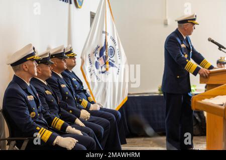 Adm. Steven Poulin, 33rd Vice Commandant of the U.S. Coast Guard, speaks at the U.S. Coast Guard Atlantic Area Command Master Chief Change of Watch ceremony in Portsmouth, Virginia, on June 6, 2022, as the Atlantic Area command staff look on. The tradition is rich in military history to allow subordinates to witness the formality of command change from one leader to another. Stock Photo