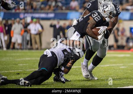 Las Vegas Raiders running back Austin Walter (32) reacts after scoring a  touchdown during an NFL