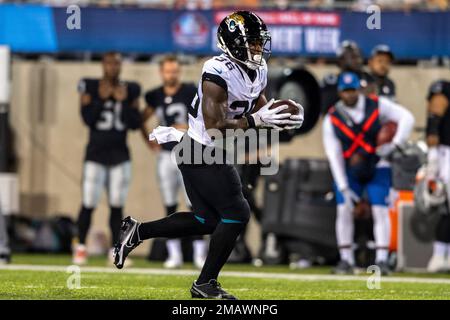 Jacksonville Jaguars running back Mekhi Sargent (36) runs with the ball  during an NFL preseason football game against the Las Vegas Raiders,  Thursday, Aug. 4, 2022, in Canton, Ohio. (AP Photo/Kirk Irwin