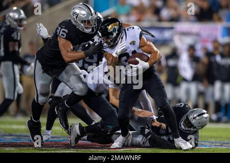 Jacksonville Jaguars defensive back Shabari Davis is tackled by Las Vegas  Raiders defensive end Tashawn Bower during the second half of the NFL  football exhibition Hall of Fame Game, Thursday, Aug. 4